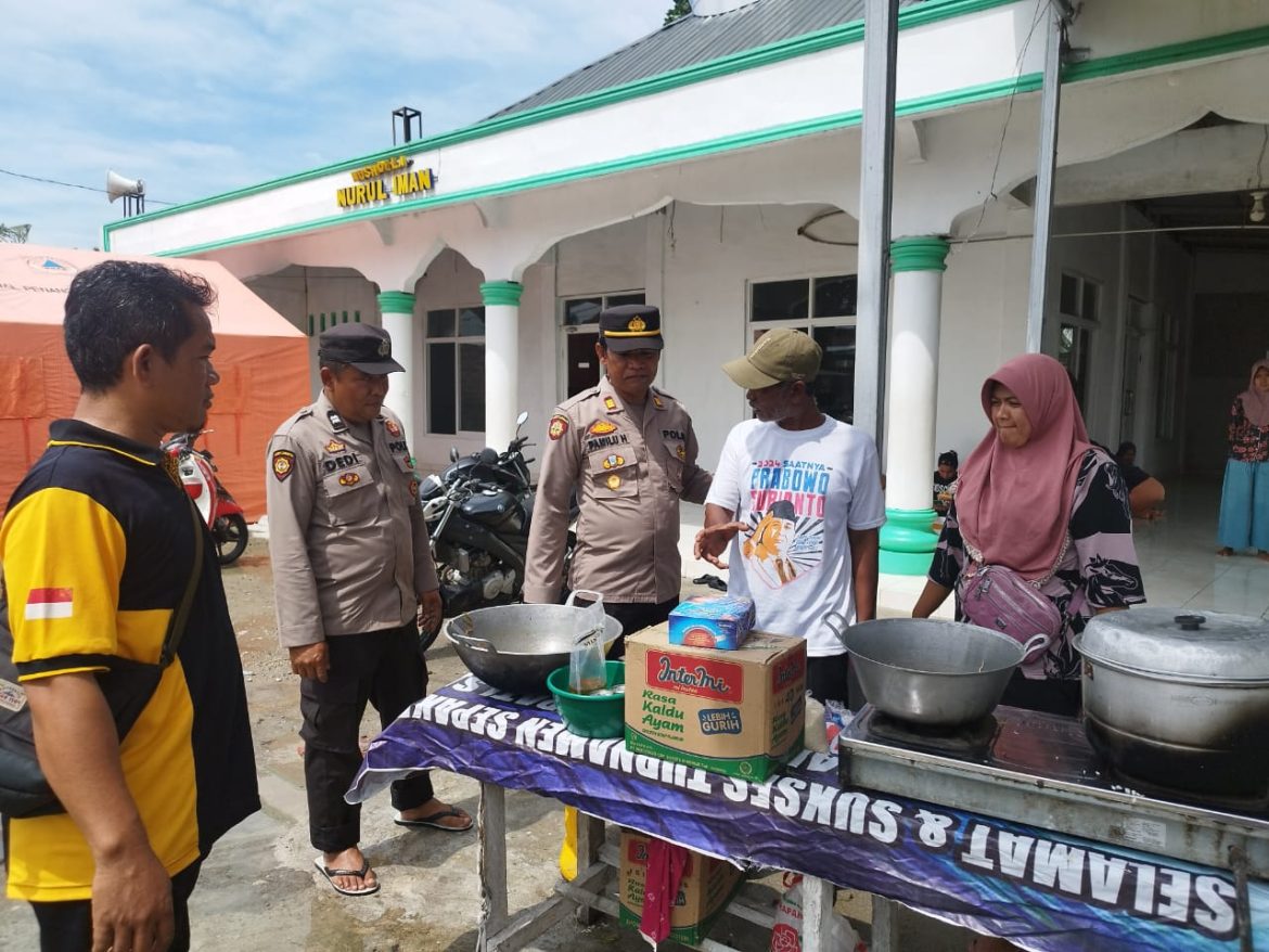 Kapolsek Tanjung Beringin AKP Pamilu Hutagaol, S.H Tinjau Lokasi Banjir
