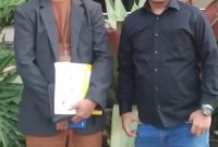 Advokat Tamrin Galingging,SH.,MH memegang surat kuasa beserta Suami korban